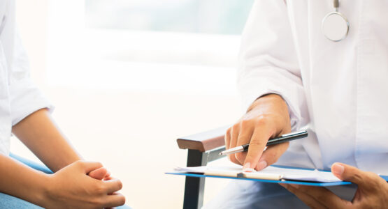 A doctor at a free HIV test clinic discusses results with a patient.