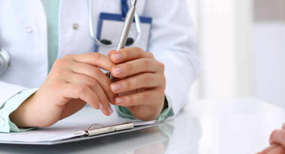 A doctor discusses plantar fasciitis at a low income health clinic.
