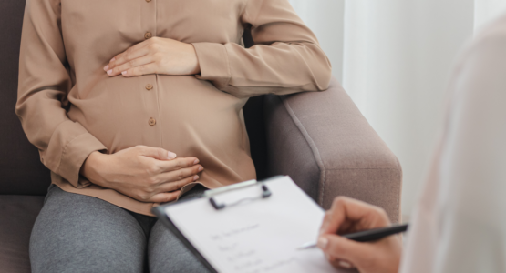 Pregnant women having a consultation with her doctor