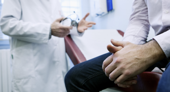 Doctor speaking to man