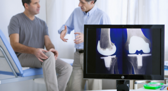 Doctor at low income clinic explains knee replacement progress