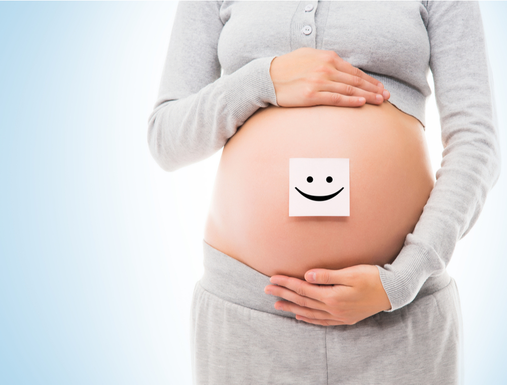 Pregnant Women posing with her stomach