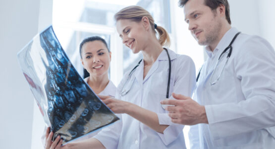 Oncologists discussing results with each other.