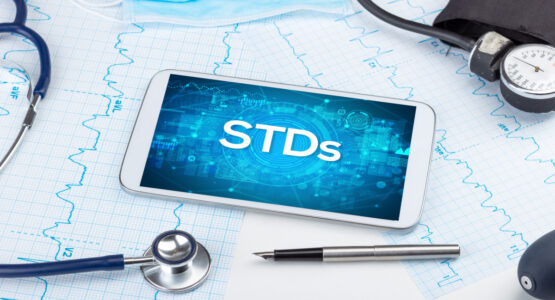 Phone on table displaying STD screen