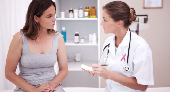 Doctor talking to female Patient