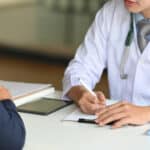 Cropped,Image,Of,Young,Smart,Doctor,Diagnosing,And,Giving,Advice