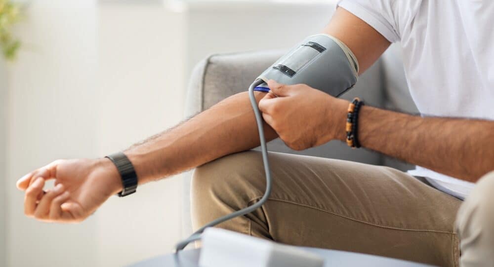 Closeup,Of,Unrecognizable,Male,Patient,Using,Modern,Tonometer,At,Home,